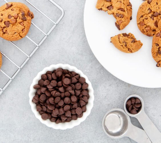 Chocolate bowl behind cookies chips